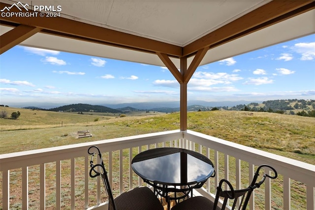 balcony featuring a rural view