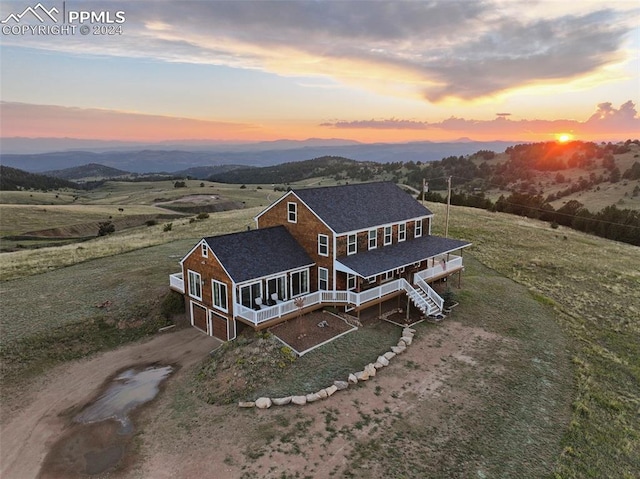 exterior space with a rural view and a porch