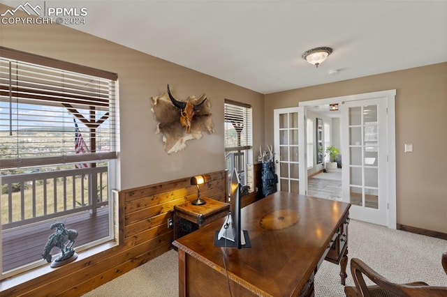 carpeted office featuring french doors