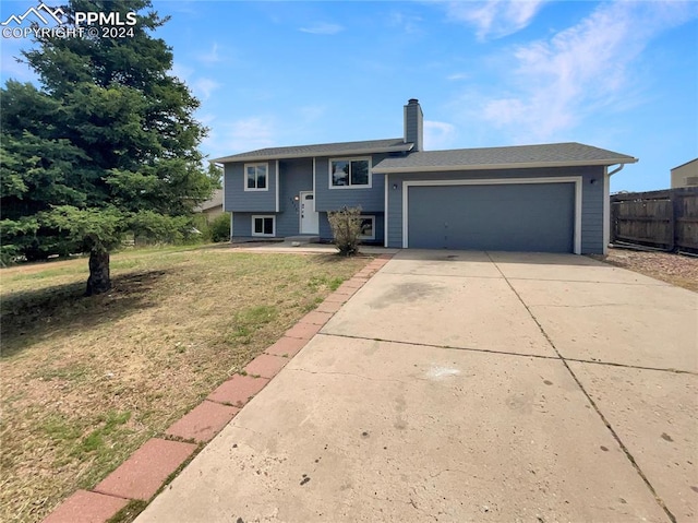 view of front facade with a front lawn and a garage