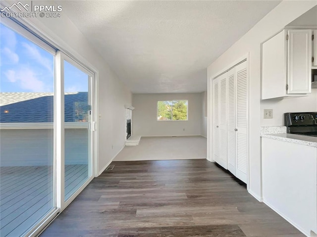 hallway with dark hardwood / wood-style floors