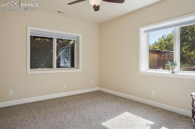 empty room featuring carpet and ceiling fan