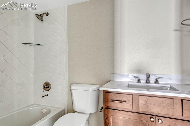 bathroom featuring tub / shower combination, a textured wall, vanity, and toilet