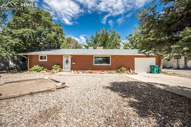 ranch-style home with a garage