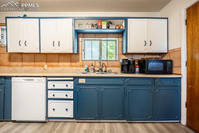 kitchen with white dishwasher, light hardwood / wood-style flooring, tasteful backsplash, sink, and white cabinetry