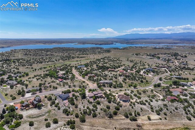 bird's eye view featuring a water and mountain view