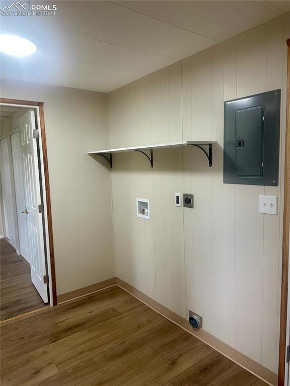 washroom featuring washer hookup, hardwood / wood-style flooring, electric panel, and electric dryer hookup