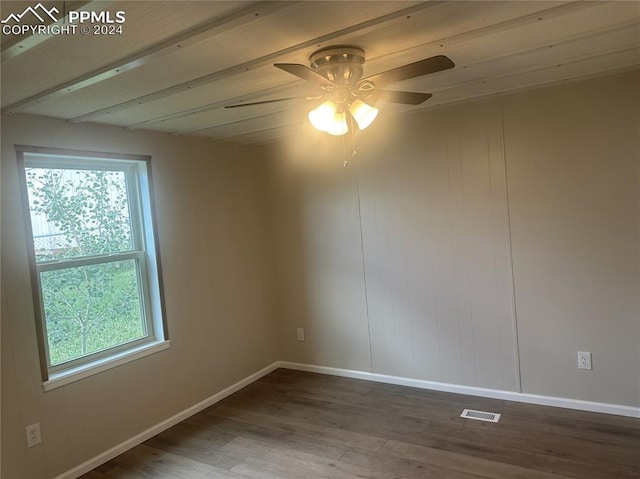 empty room with ceiling fan and wood-type flooring