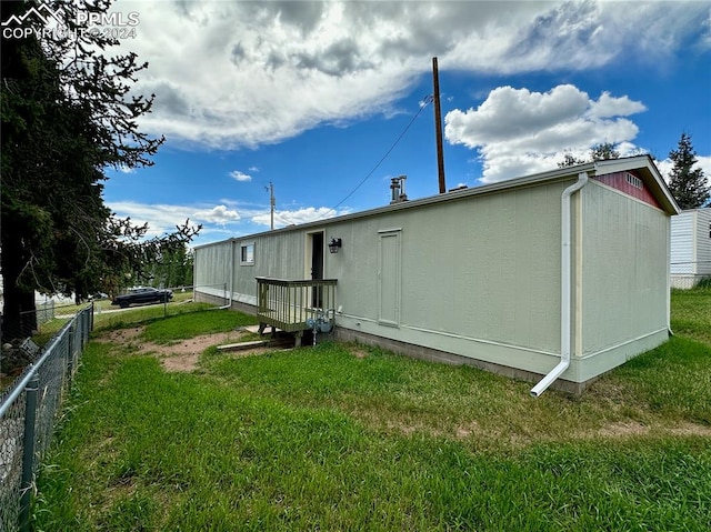 rear view of property with a yard