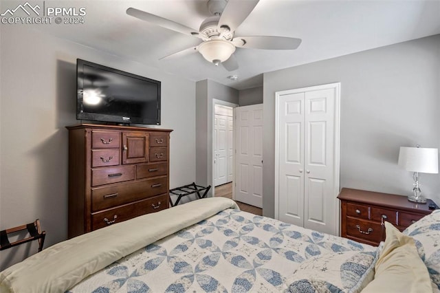 bedroom with ceiling fan and a closet