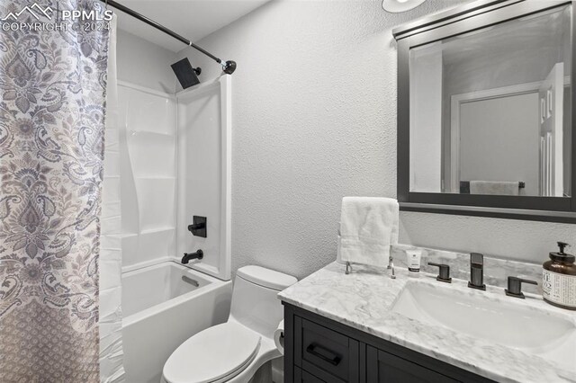 full bathroom featuring vanity, toilet, and shower / bath combo