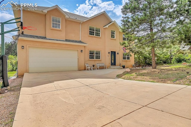 view of front of property featuring a garage