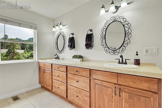 bathroom featuring tile patterned floors and vanity