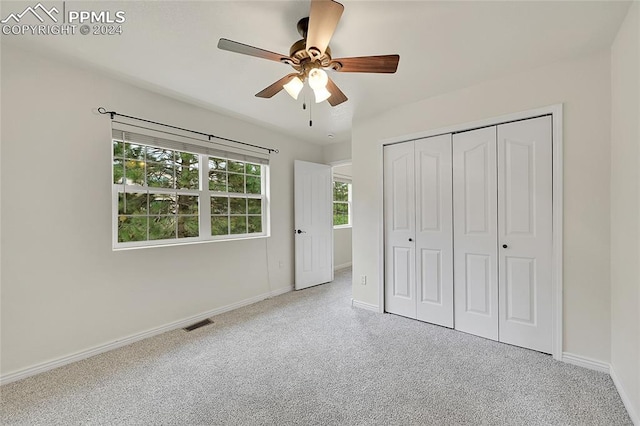 unfurnished bedroom featuring a closet and ceiling fan