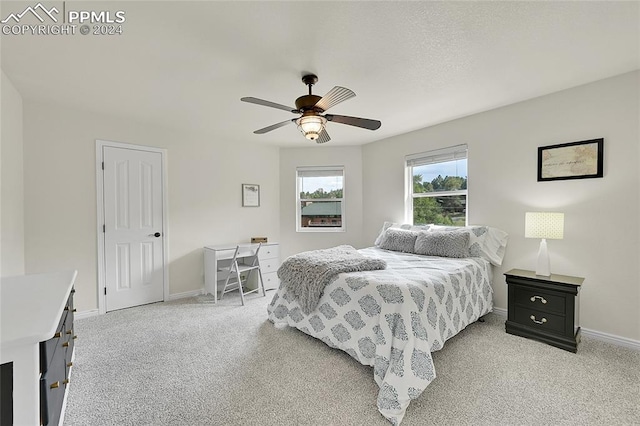 bedroom featuring ceiling fan and light colored carpet