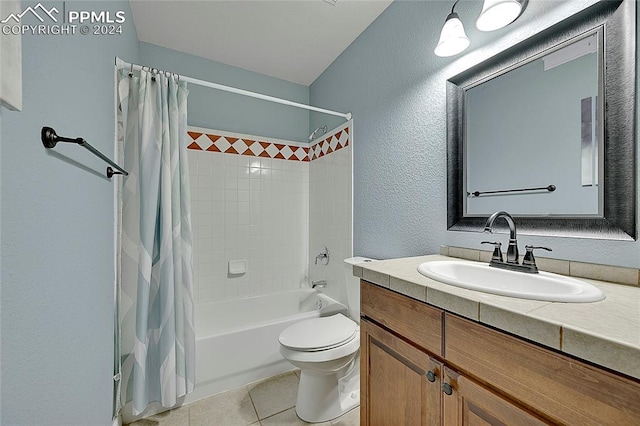 full bathroom featuring vanity, toilet, tile patterned flooring, and shower / bath combo with shower curtain