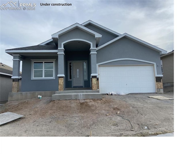 view of front of property featuring a garage