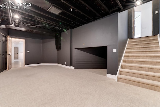 basement with carpet flooring