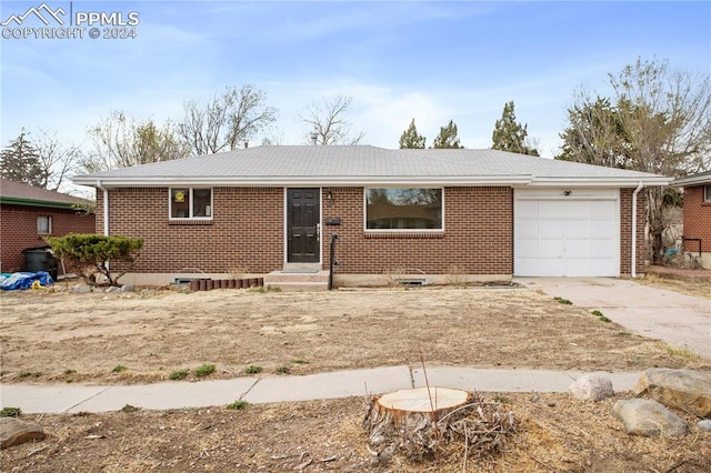 single story home featuring a garage