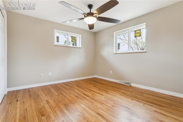 unfurnished room featuring ceiling fan and wood-type flooring