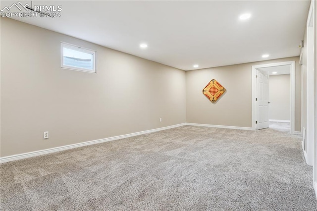 basement with light colored carpet