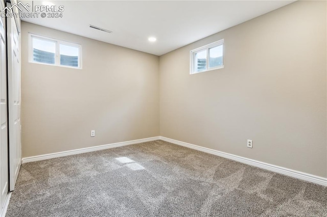 basement featuring plenty of natural light and carpet floors