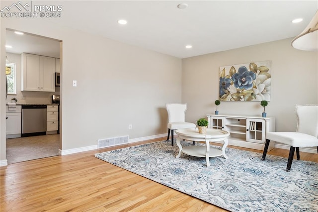 sitting room featuring hardwood / wood-style flooring