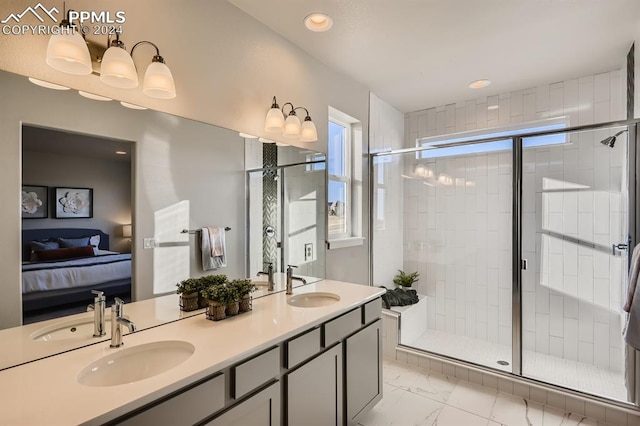 bathroom with vanity, a wealth of natural light, and a shower with shower door