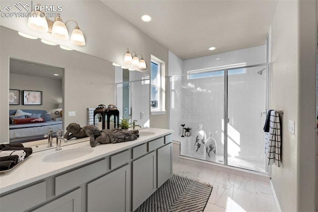 bathroom featuring vanity and a shower with door