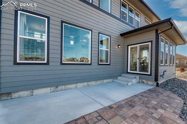 doorway to property featuring a patio