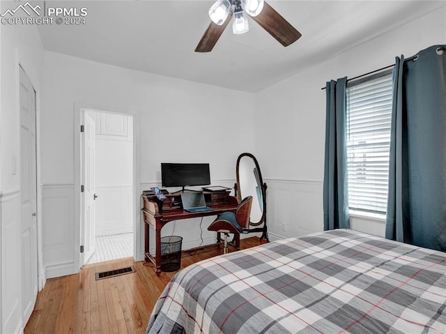 bedroom with light wood-type flooring and ceiling fan