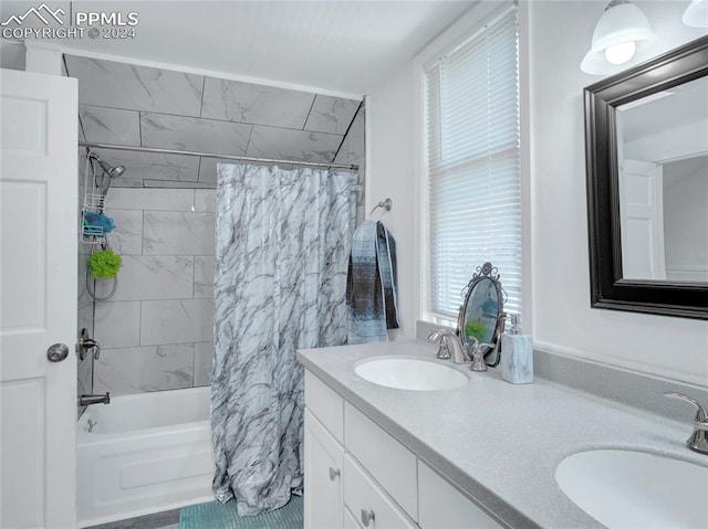 bathroom featuring vanity and shower / bath combination with curtain