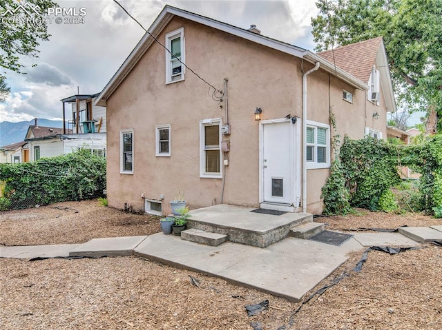 back of house featuring a patio