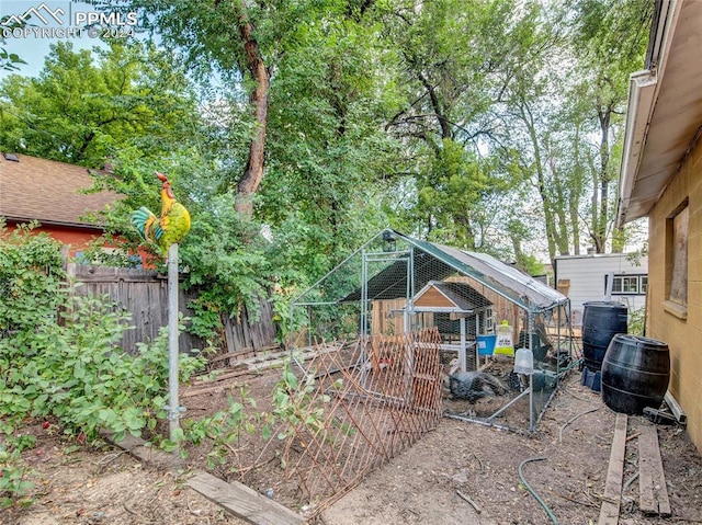 view of yard with an outbuilding and central air condition unit