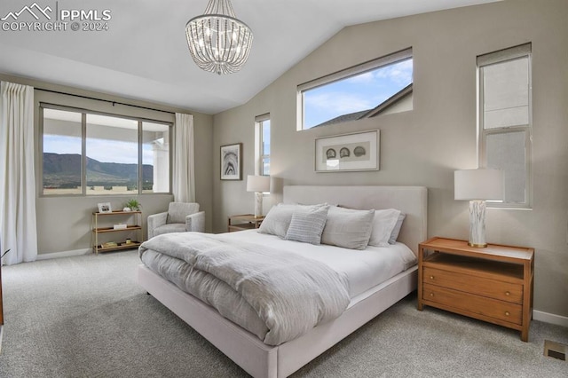 carpeted bedroom featuring lofted ceiling, a mountain view, and a notable chandelier