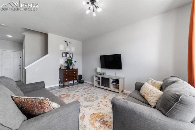 7375 Sandy Springs Pt, Fountain, CO 80817 - living area with baseboards, a notable chandelier, and wood finished floors