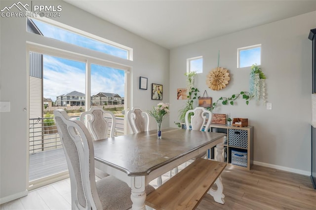 dining space with light wood-type flooring