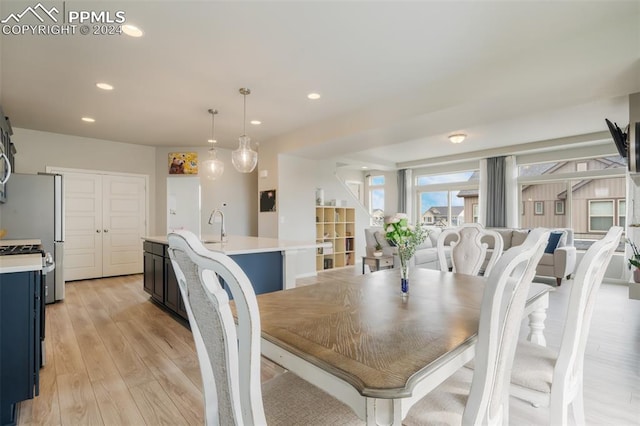 dining area with light hardwood / wood-style flooring