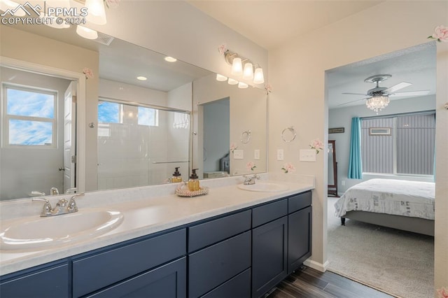 bathroom featuring ceiling fan, walk in shower, wood-type flooring, and vanity