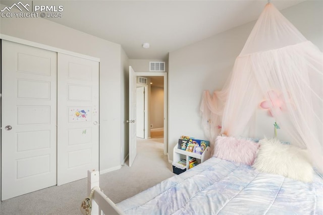 bedroom with a closet and carpet flooring