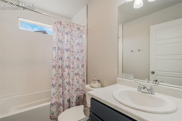 full bathroom with vanity, toilet, and shower / tub combo with curtain