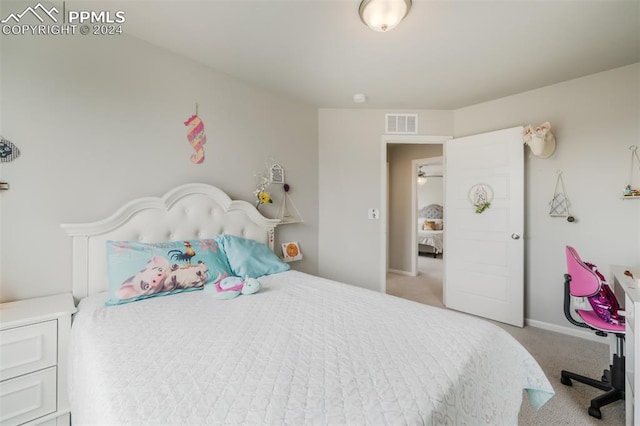 bedroom featuring light colored carpet