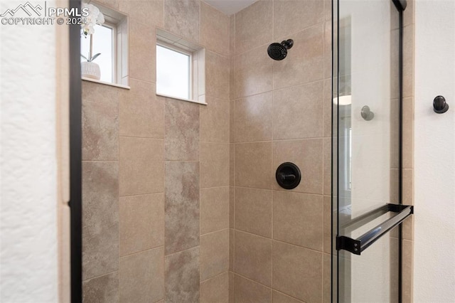 bathroom featuring tiled shower