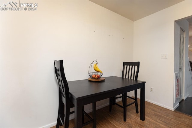 dining space featuring dark hardwood / wood-style floors