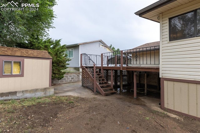 exterior space featuring a shed and a deck