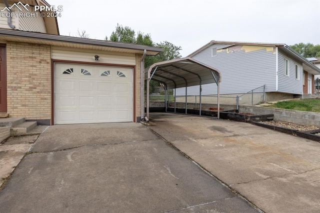 garage featuring a carport