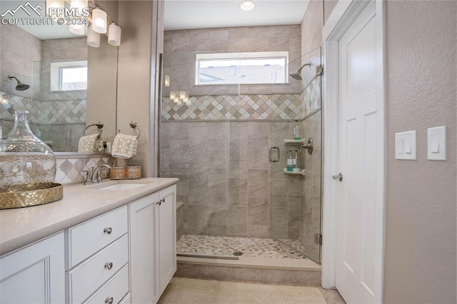 bathroom with vanity and walk in shower