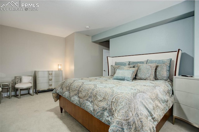 bedroom featuring light colored carpet