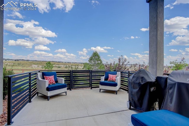 view of patio / terrace featuring a grill and a balcony