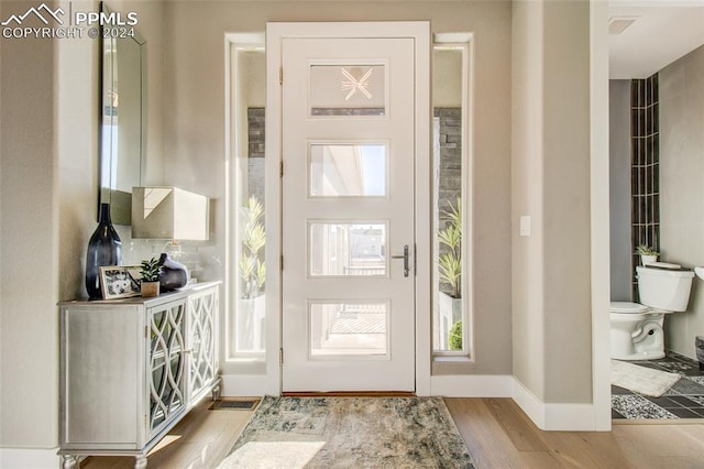 foyer with light hardwood / wood-style floors